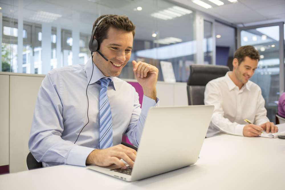businessman getting online support with headset